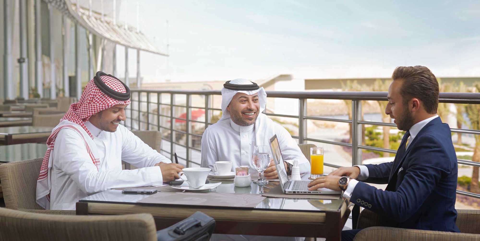 Business professionals representing Bupa Arabia corporate health insurance