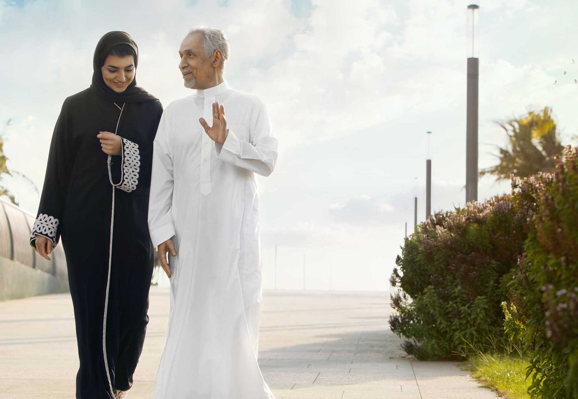 Woman walking with elderly man, Bupa Parents health insurance